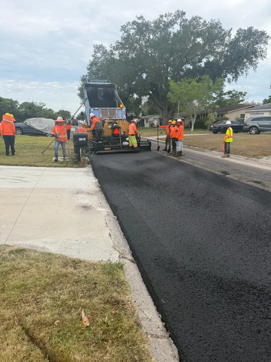 Blacktop Florida crew working on commercial property at dawn